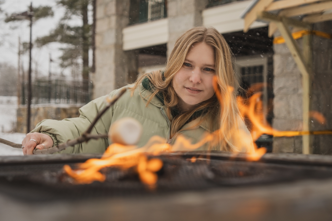 Linden Schaefer roasting a marshmallow