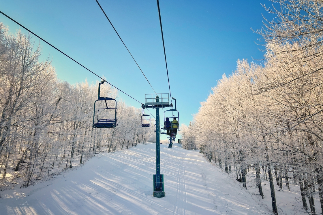 Two-person chairlift in the snow