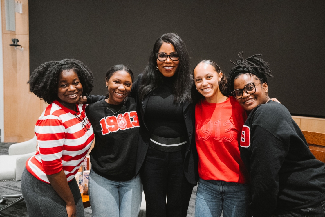 Students pose with Dr. Shabazz