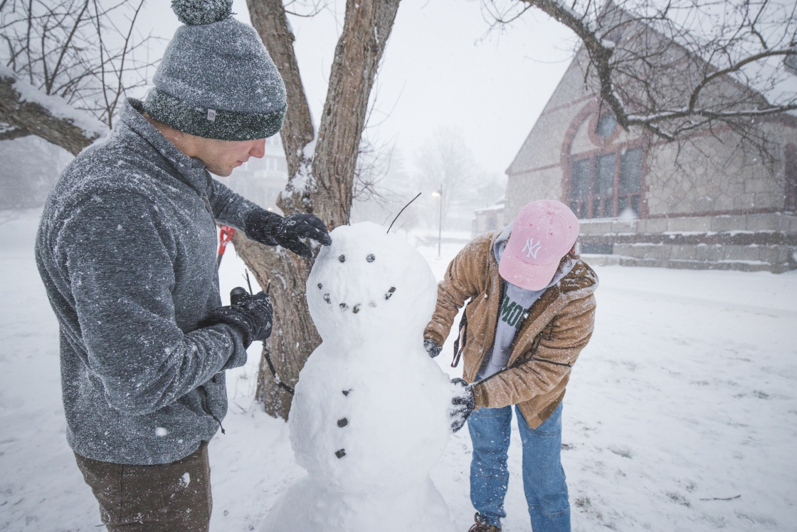 Henry York and Senate Shaw building a snowman