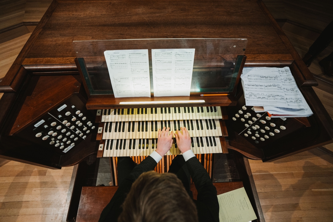 Birds-eye-view of person playing an organ