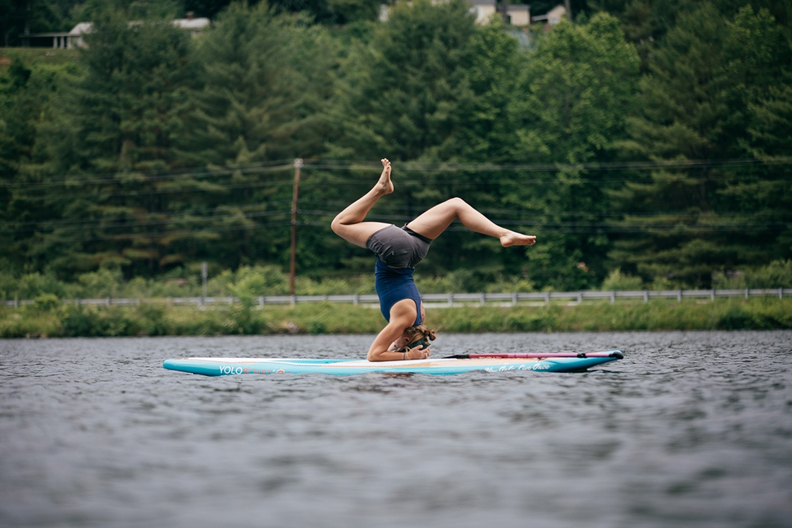 Morgan Haas leads a paddleboard yoga classes on the Connecticut River.