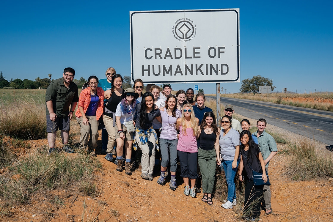 The class poses at the entrance to the Cradle of Humankind World Heritage Site