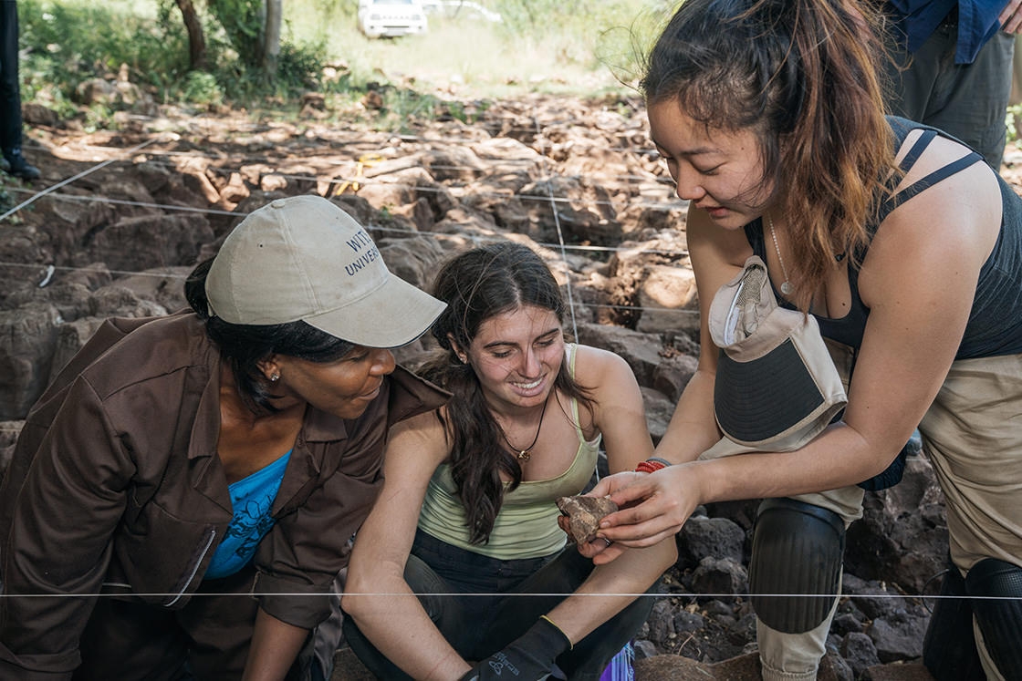 Cathy Li ’17 holds a fossil of Australopithecus sediba she uncovered during the dig.