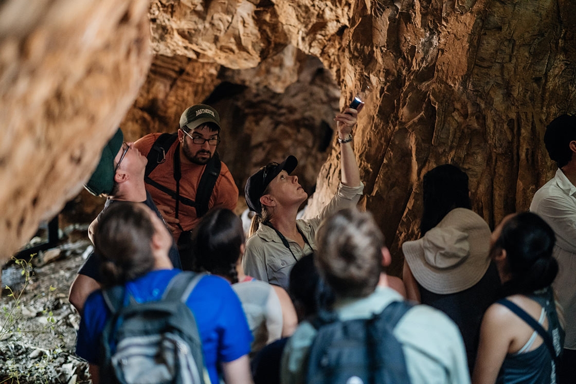 Marina Elliot, a researcher at the University of Witwatersrand, points to a feature in the entrance to the cave at Rising Star.