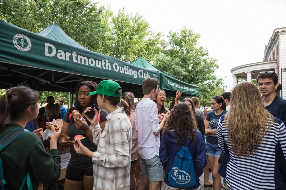 Students enjoy food cooked by the Dartmouth Outing Club at a summer bbq