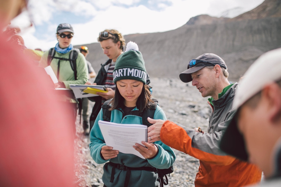 On the last day on the Athabasca Glacier, the students map the forefield where the ice has melted. Associate Professor Erich Osterberg, right, answers a question from Angela Li ’20.