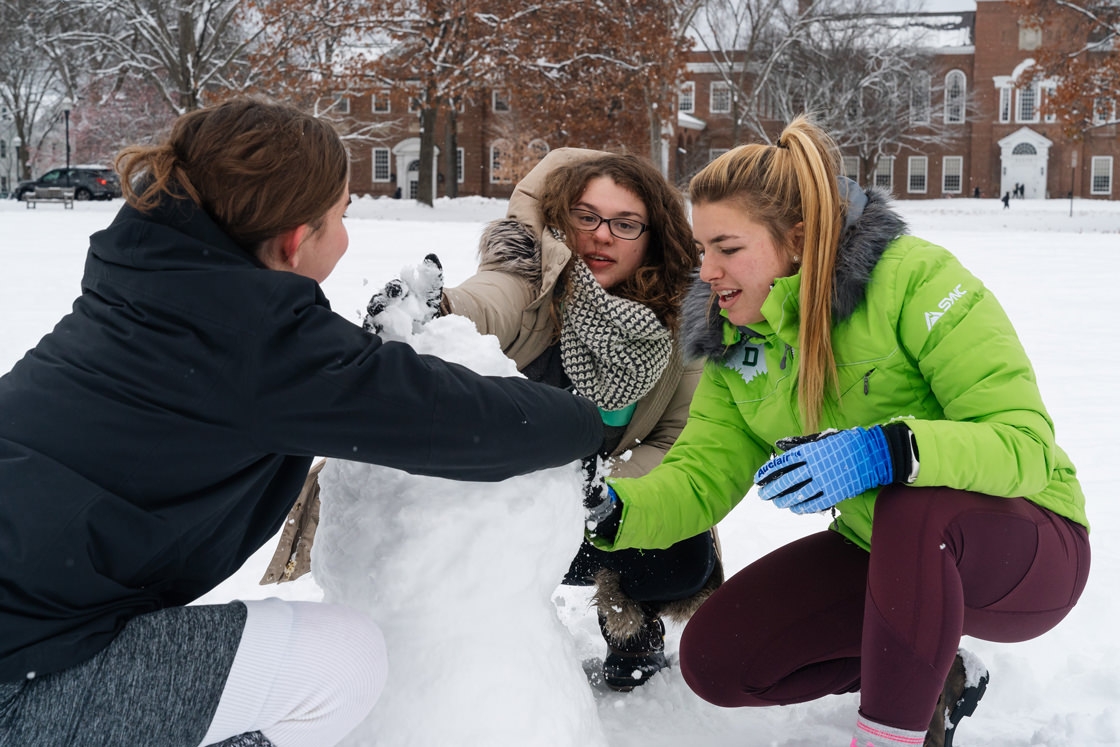 Students build a snowman