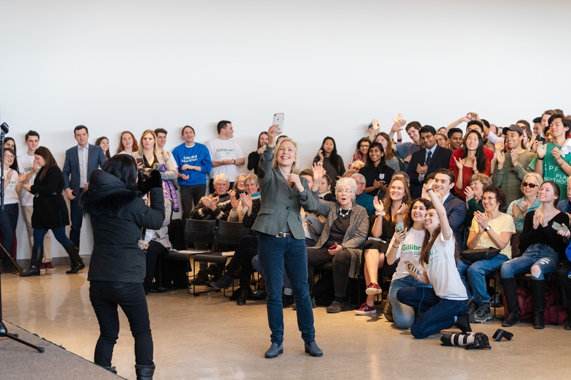 Kirsten Gillibrand takes a selfie in front of a crowd of students