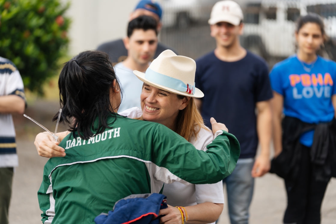 Marisa Magsarili '19 gets a hug from Carmen Yulín Cruz,