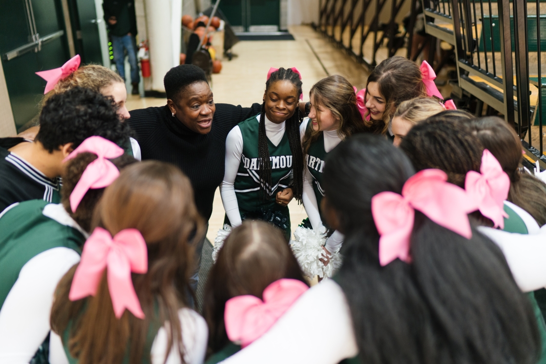 Dartmouth cheerleaders huddle-up for a team pep talk.
