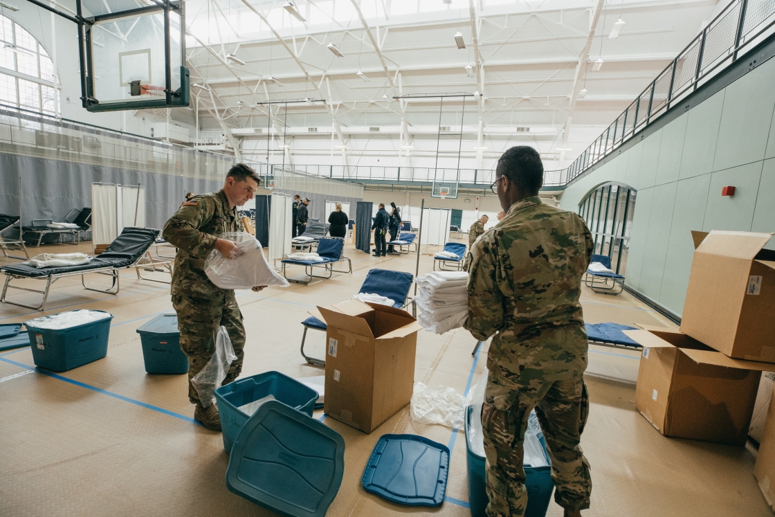 National Guard unpacking supplies in West Gym