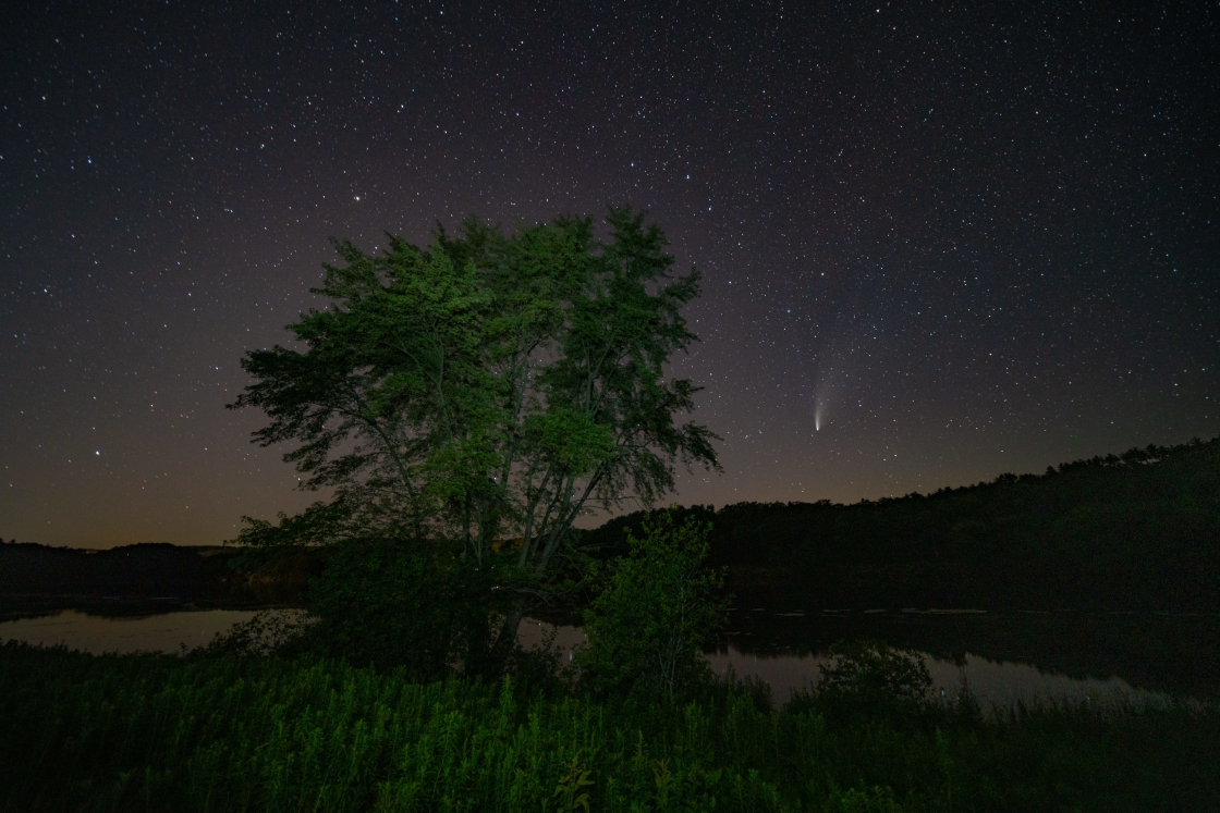 Comet over Connecticut River with house lights reflecting
