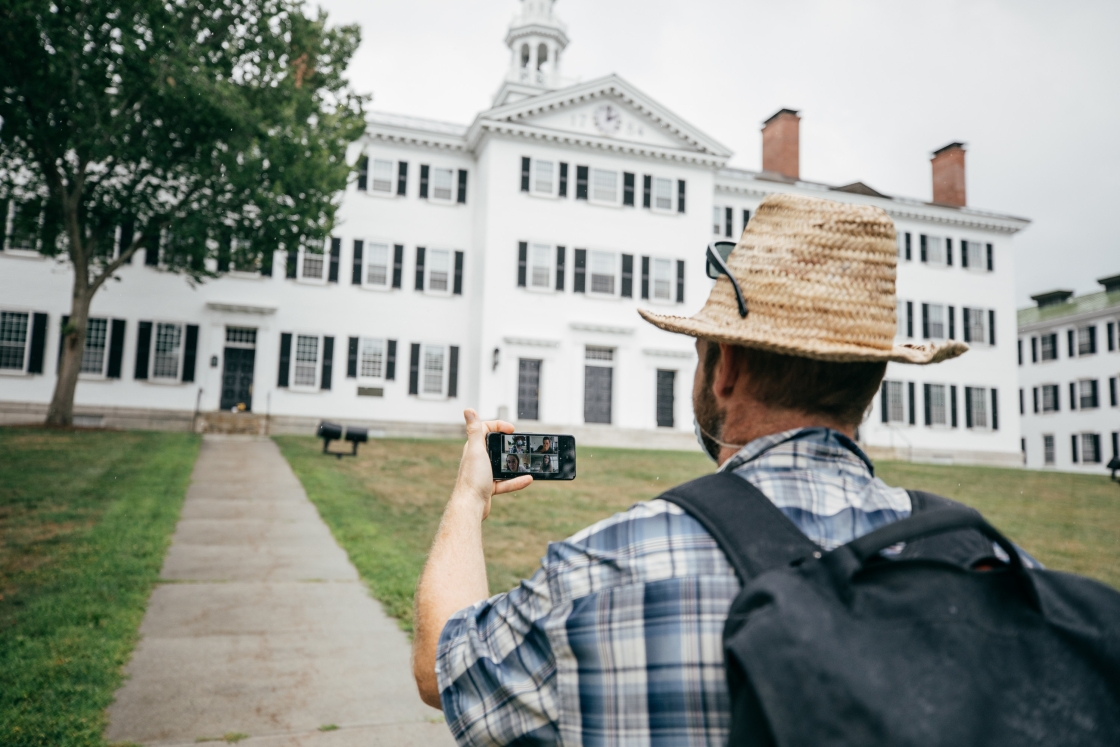 OPO staff member Rory Gawler approaches Dartmouth Hall as his team of students remotely guide him to a target.