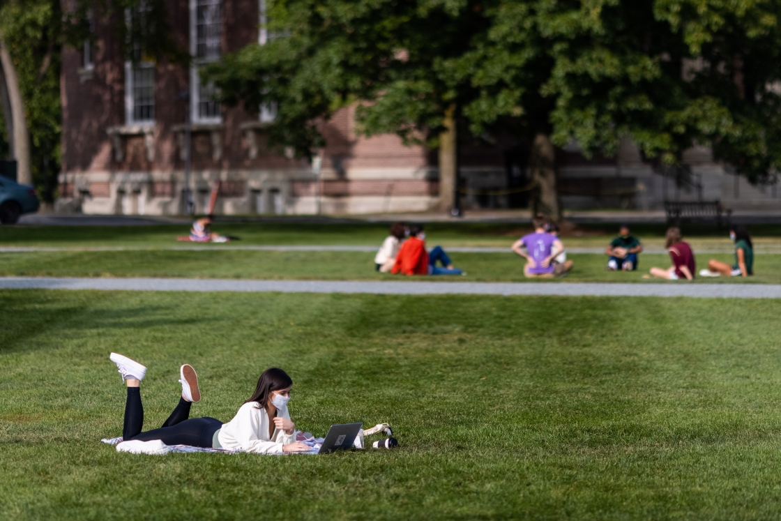 Student lounging on the Green