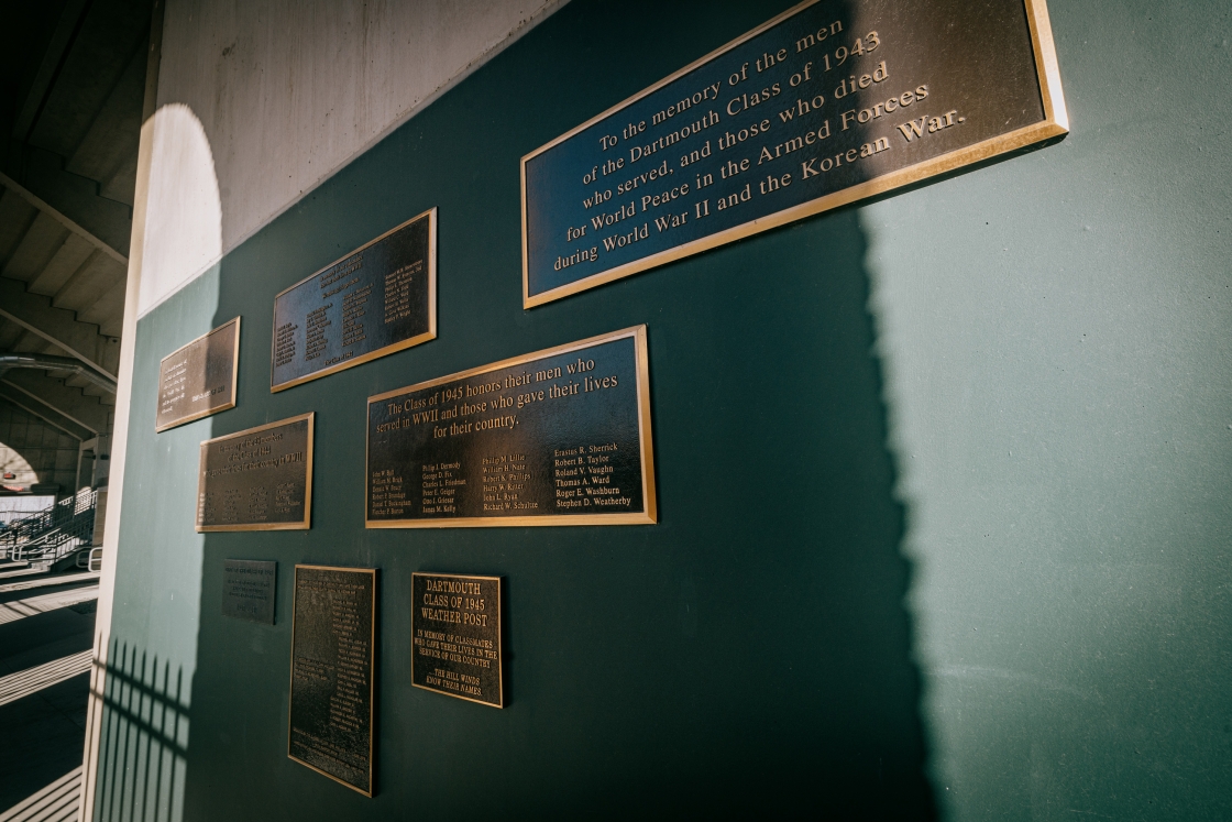 A wall of several memorial plaques