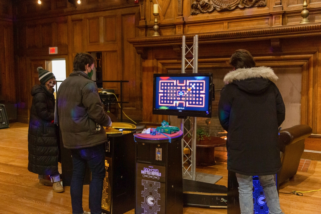 Students playing Pac Man inside Collis