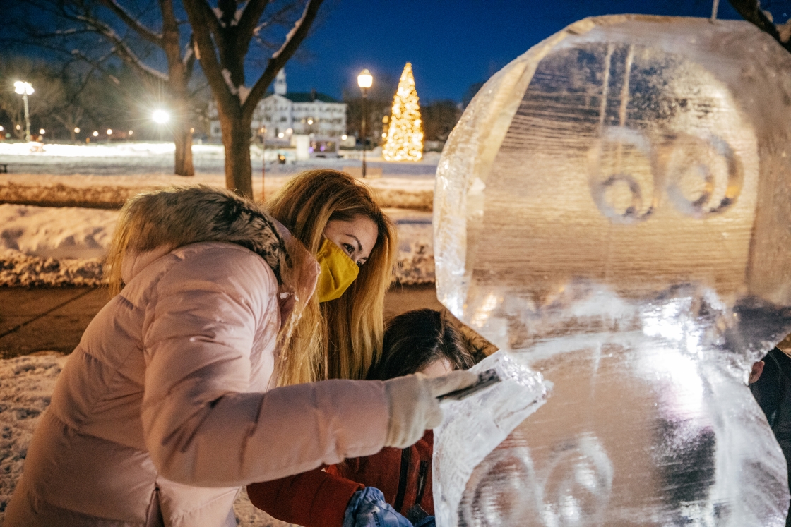 Student carving an ice sculpture