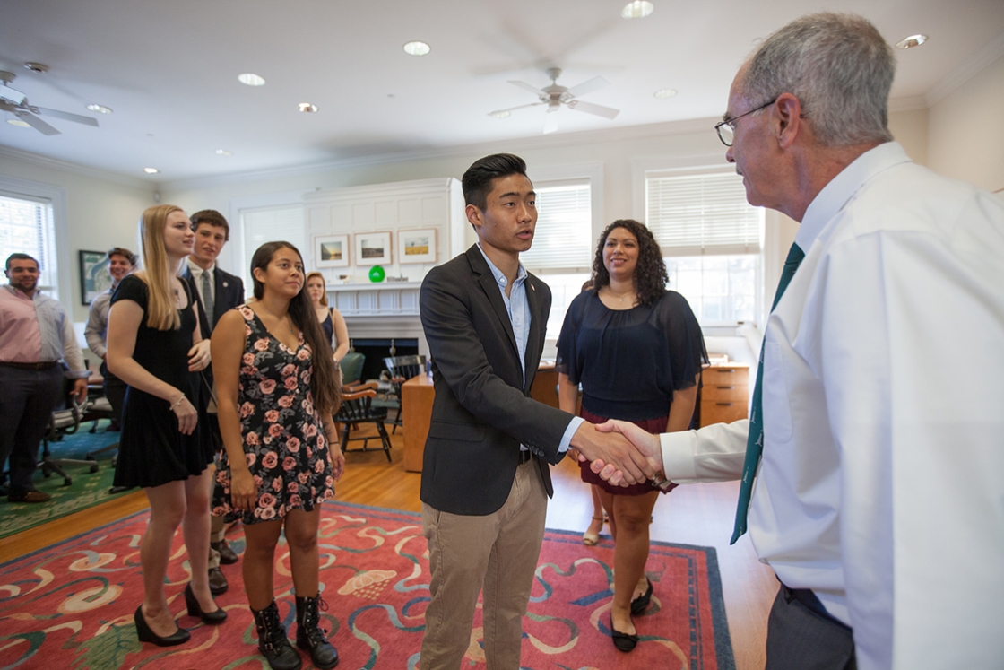 President Phil Hanlon ’77 greets the members of the first-year class in his office