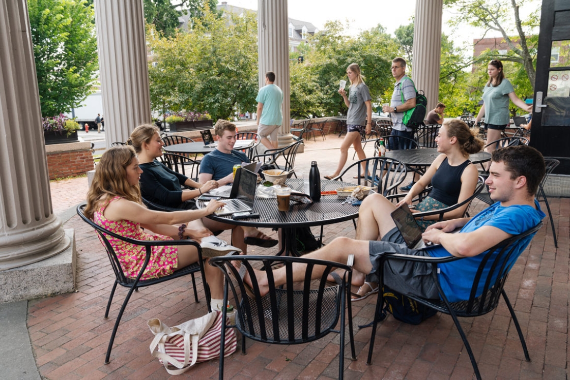 The Collis patio is a popular meeting spot for students to relax and catch up
