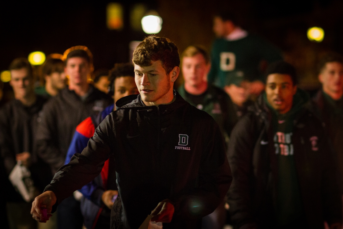 Student-athlete marches in the parade