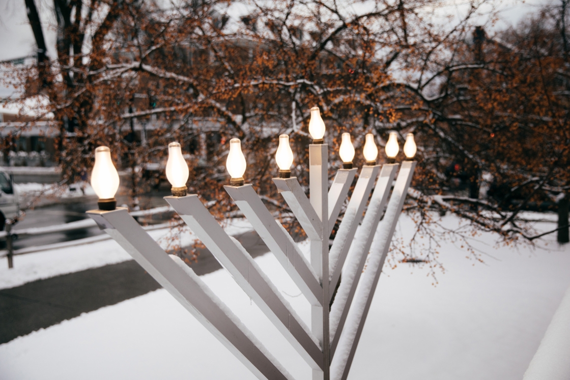 Menorah candles shine outside the Roth Center