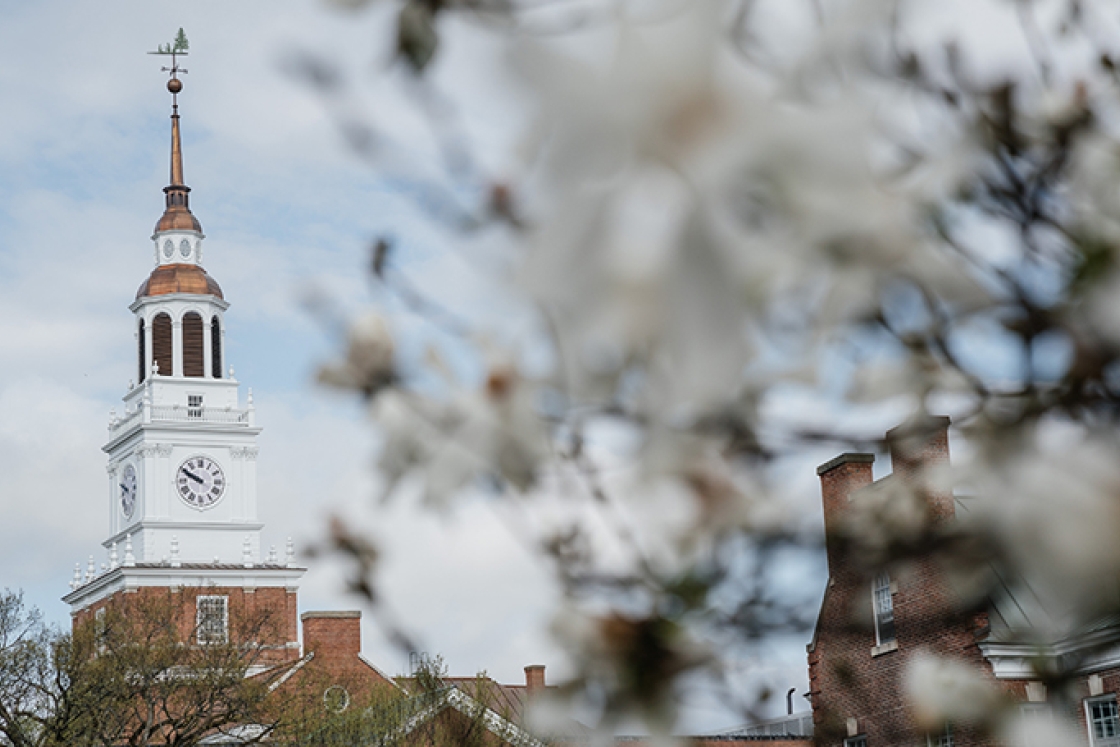 Baker Tower with a white flowering tree in the foreground