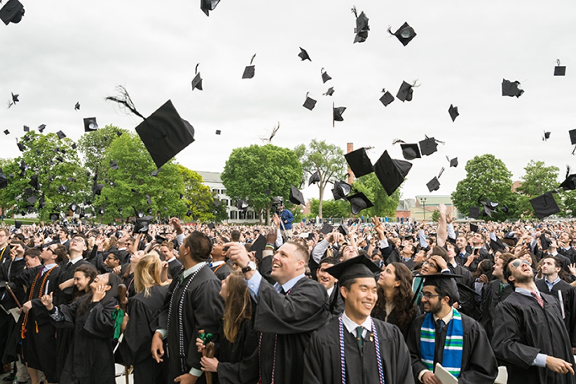 Students celebrate at the end of the commencement ceremony.