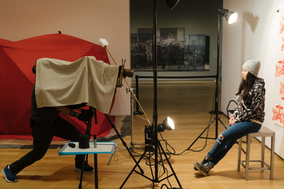 Photographer Will Wilson makes a tintype portrait of Gabe Canfield '21 as part of an exhibit at the Hood Museum of Art.