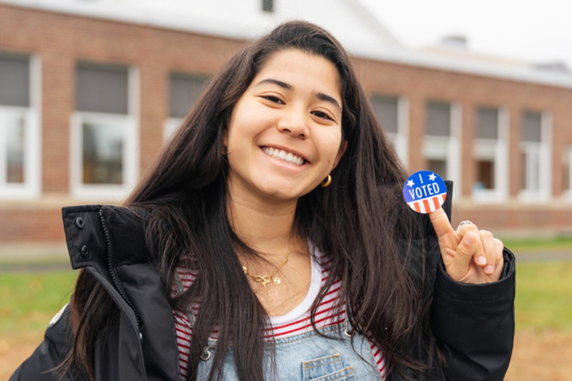 Donia Tung '22 shows off her &quot;I Voted&quot; sticker after casting her ballot in the 2018 midterm election.