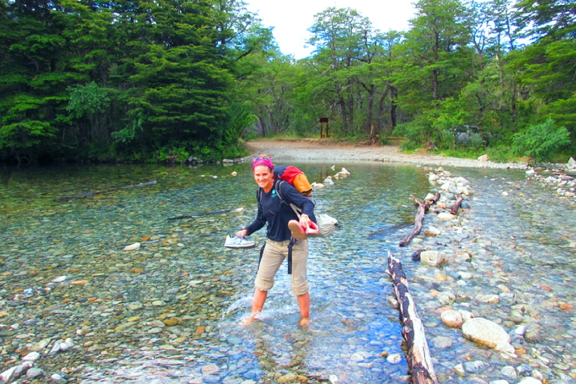 Flora Krivak-Tetley wading in a creek