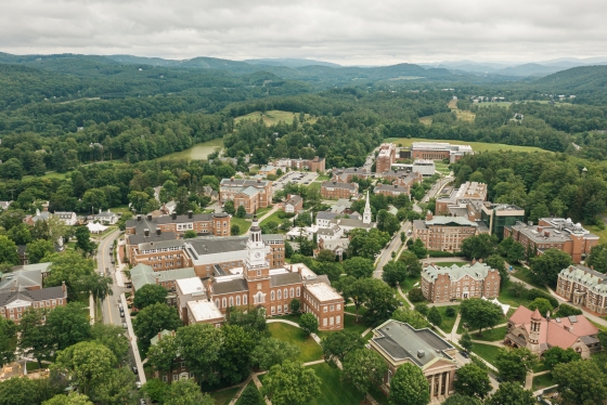 An aerial view of the hills and mountains surrounding campus which are especially lush from recent rain. One could say the trees are almost the precise shade of Dartmouth green.