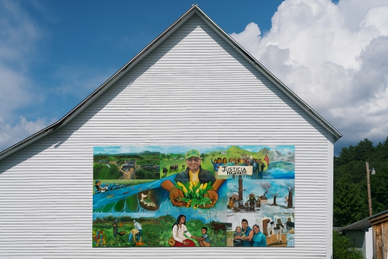 Students in the “Migrant Lives and Labor in the Upper Valley” class created a mural exploring the themes of migration and farming; it's on display on the side of the barn at the Organic Farm..
