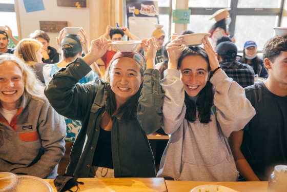 Students place bowls on their heads to order more soup