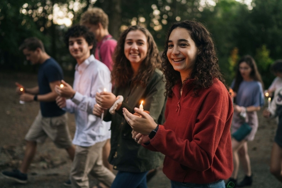 Four students with candles