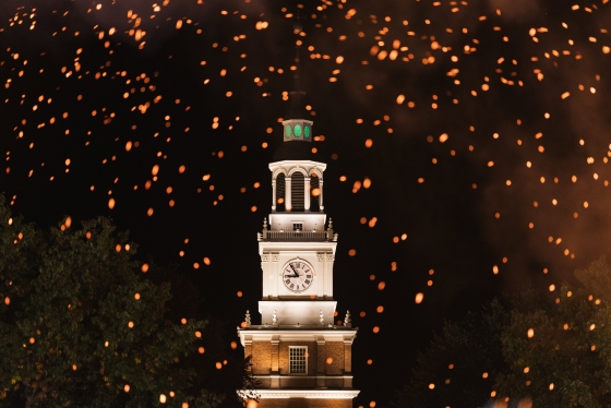 Homecoming bonfire embers light up the tower