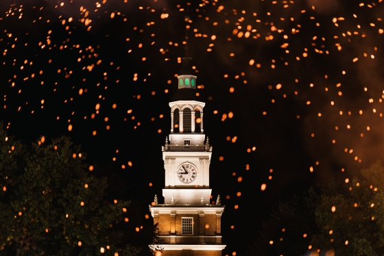 Baker tower at night, surrounded by fire sparks