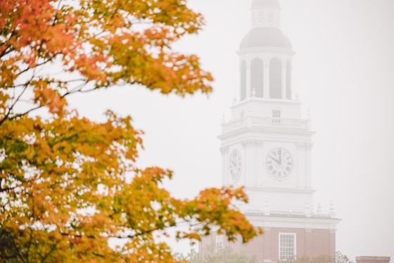 Baker tower covered by mist and framed by orange leaves
