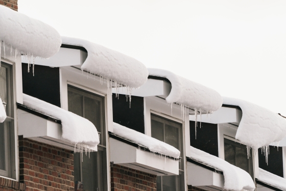 Window roofs with snow curling down