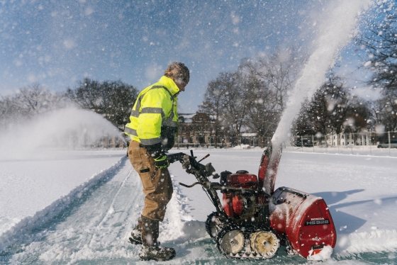 FO&amp;M worker snowblowing the ice rinks on the Green