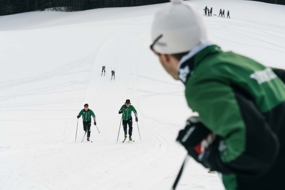People nordic skiing uphill