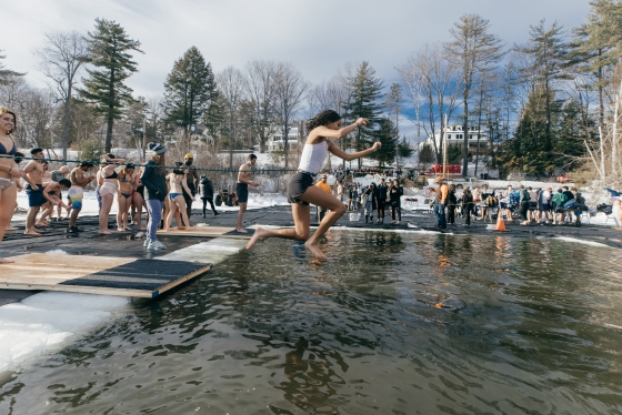 A student jumping into Occom pond