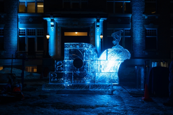 Ice sculpture at night lit with blue lights