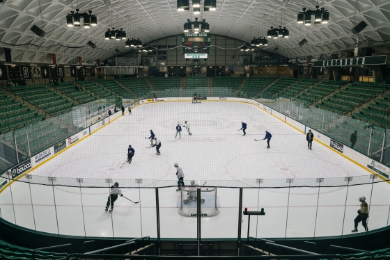 People playing hockey in Thompson Arena