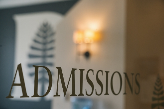 Glass sign for Dartmouth's Office of Admissions