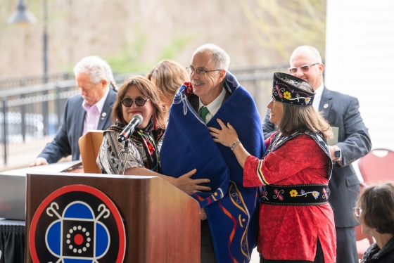 Philip J. Hanlon wears traditional Mohegan blanket