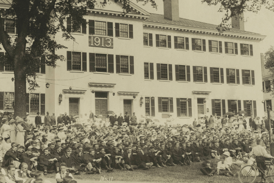 Graduates and families sitting in lines in front of Dartmouth Hall