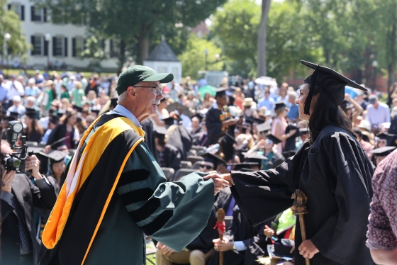 President Hanlon shakes a graduates hand