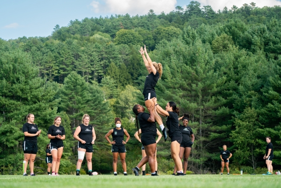Women's rugby forming a pyramid
