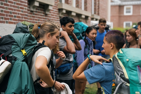 Students in hiking packs